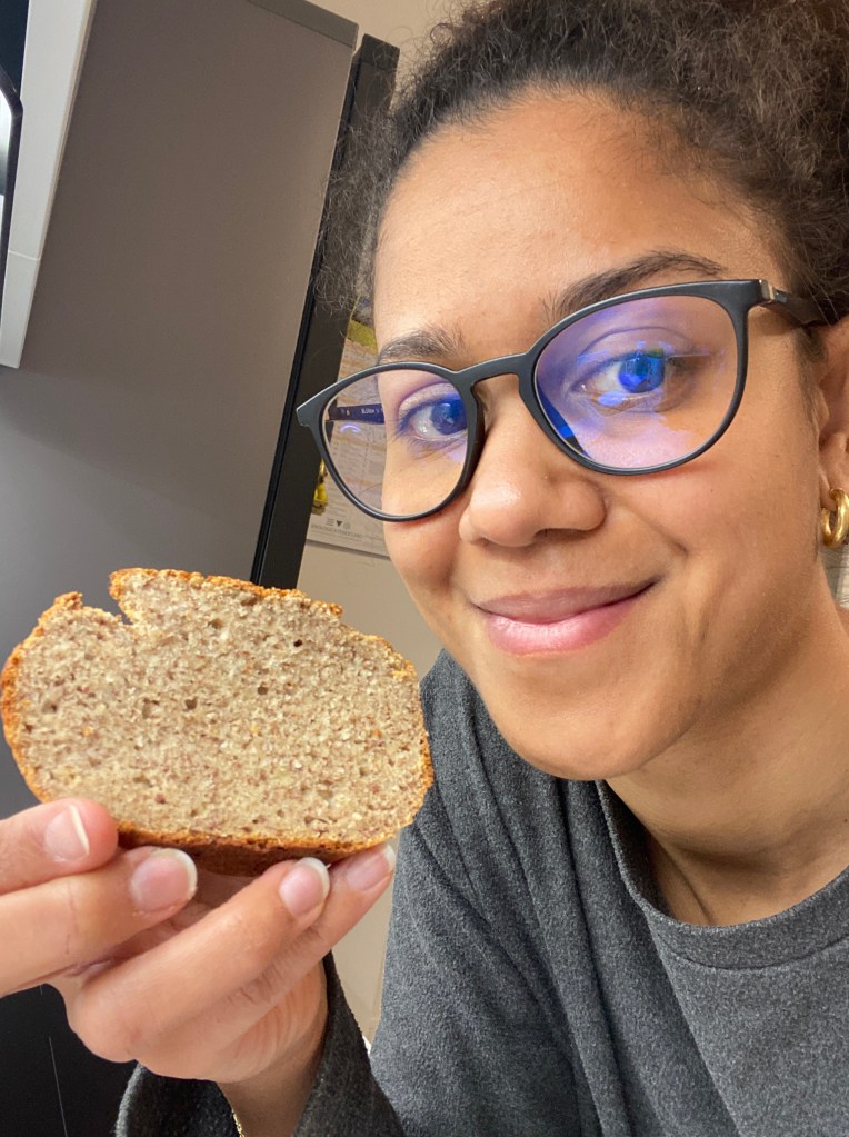 Person holding slice of banana bread